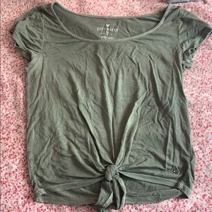 Army green shirt with a tie in the front